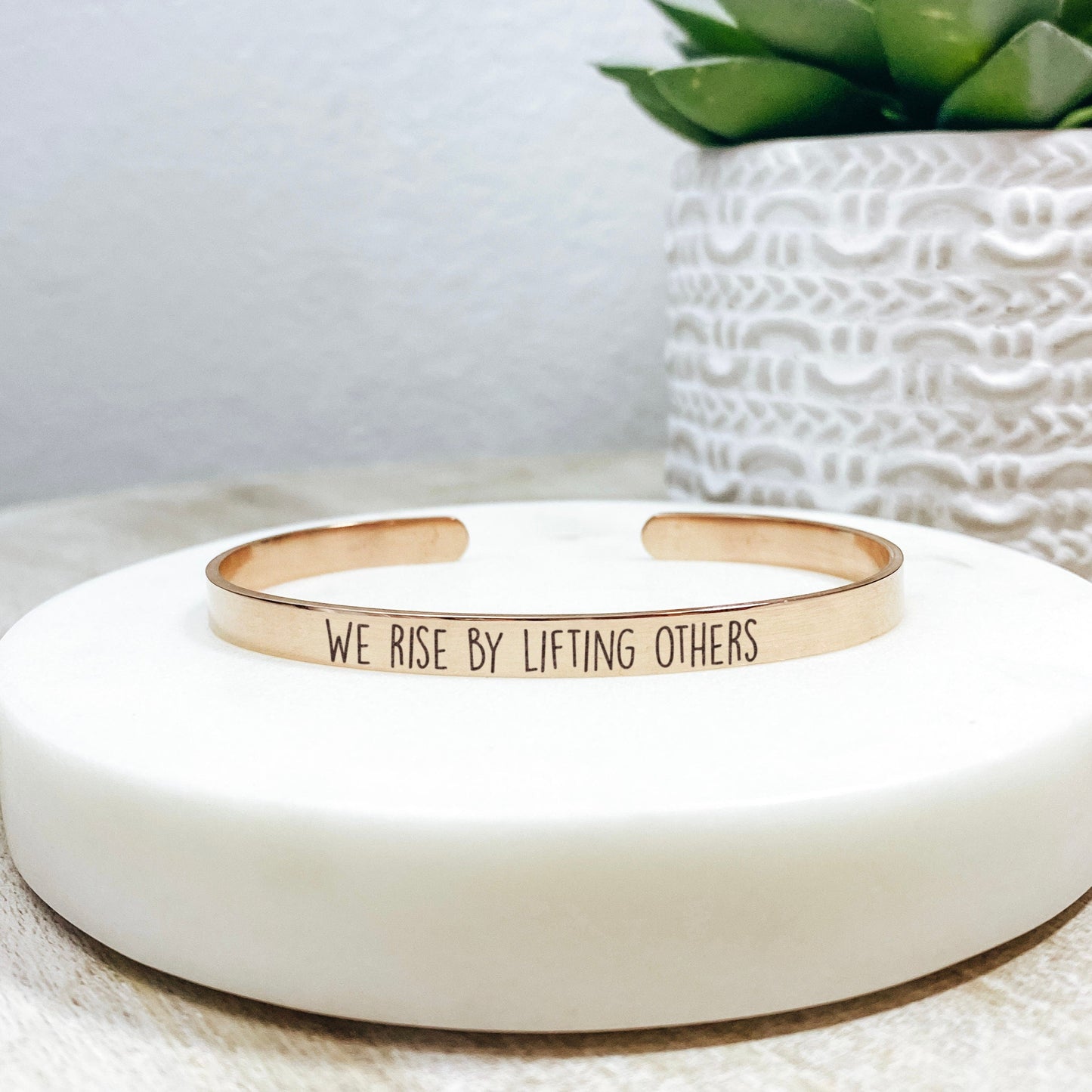 WE RISE BY LIFTING OTHERS CUFF - Avy + Tay